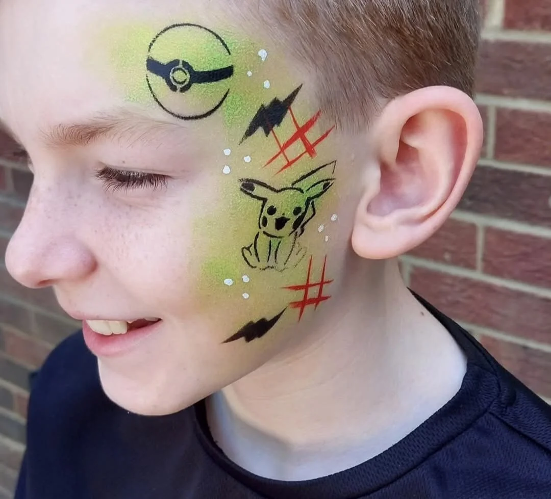 Boy with Pokemon design face paint