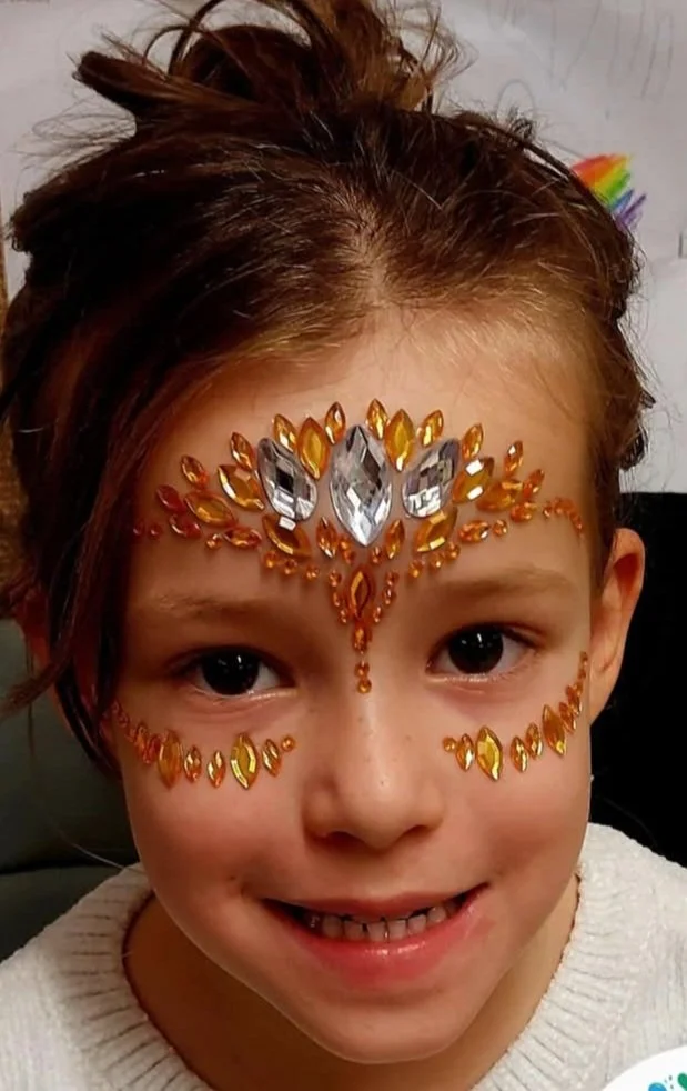 Girl with face gems
