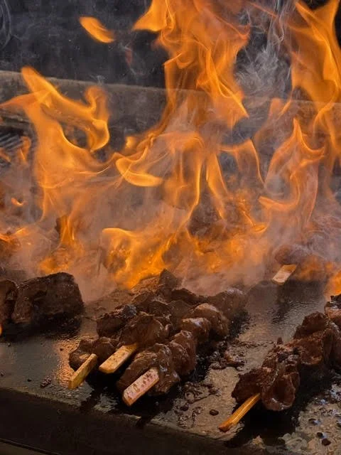Peru Anticuchos being cooked on the flame grill