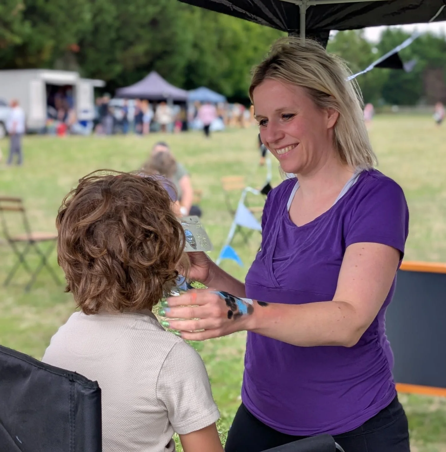 Maggie aat work on a woman at an event