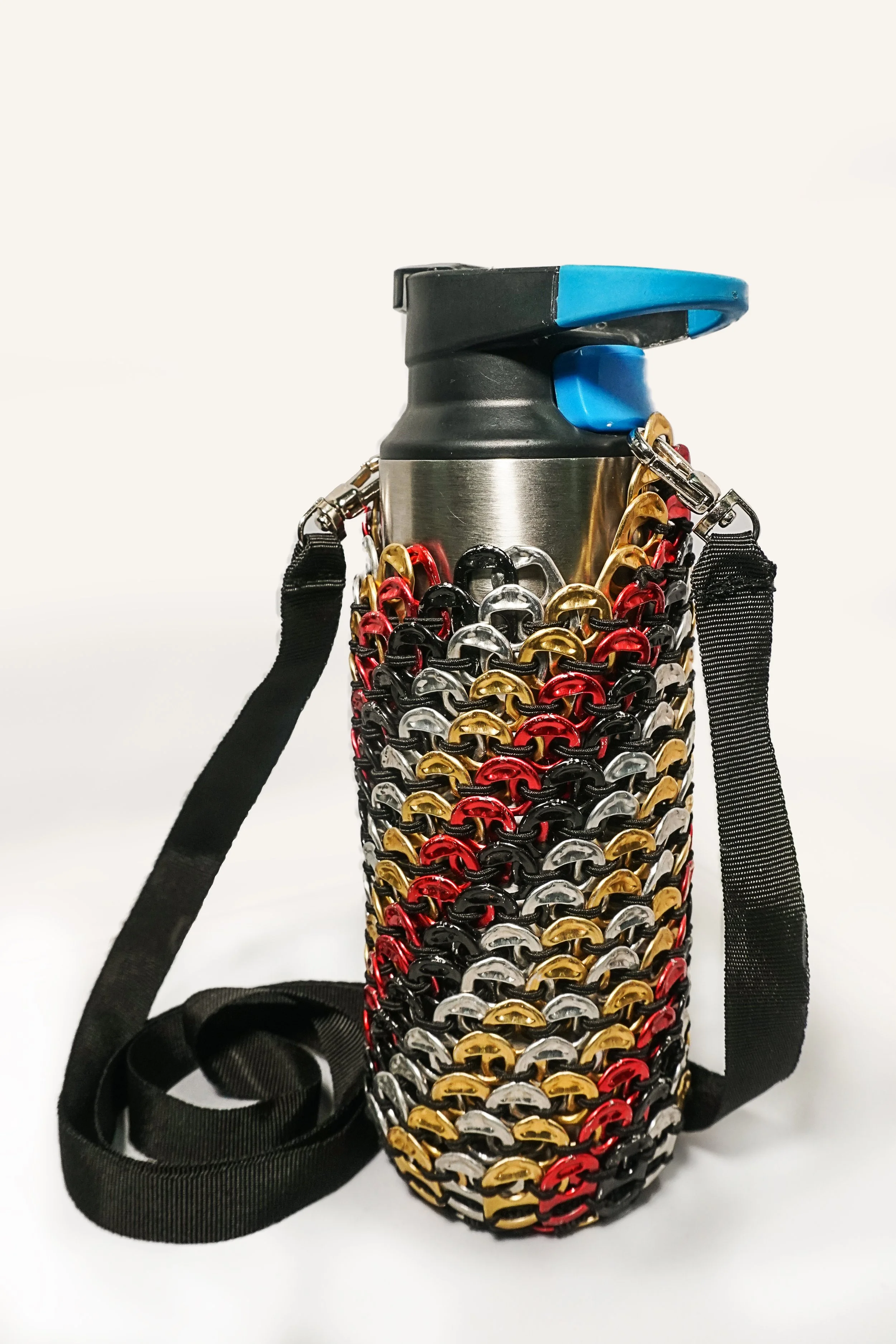 Water bottle holder with should strap in multicoloured spirals, made from ring pulls