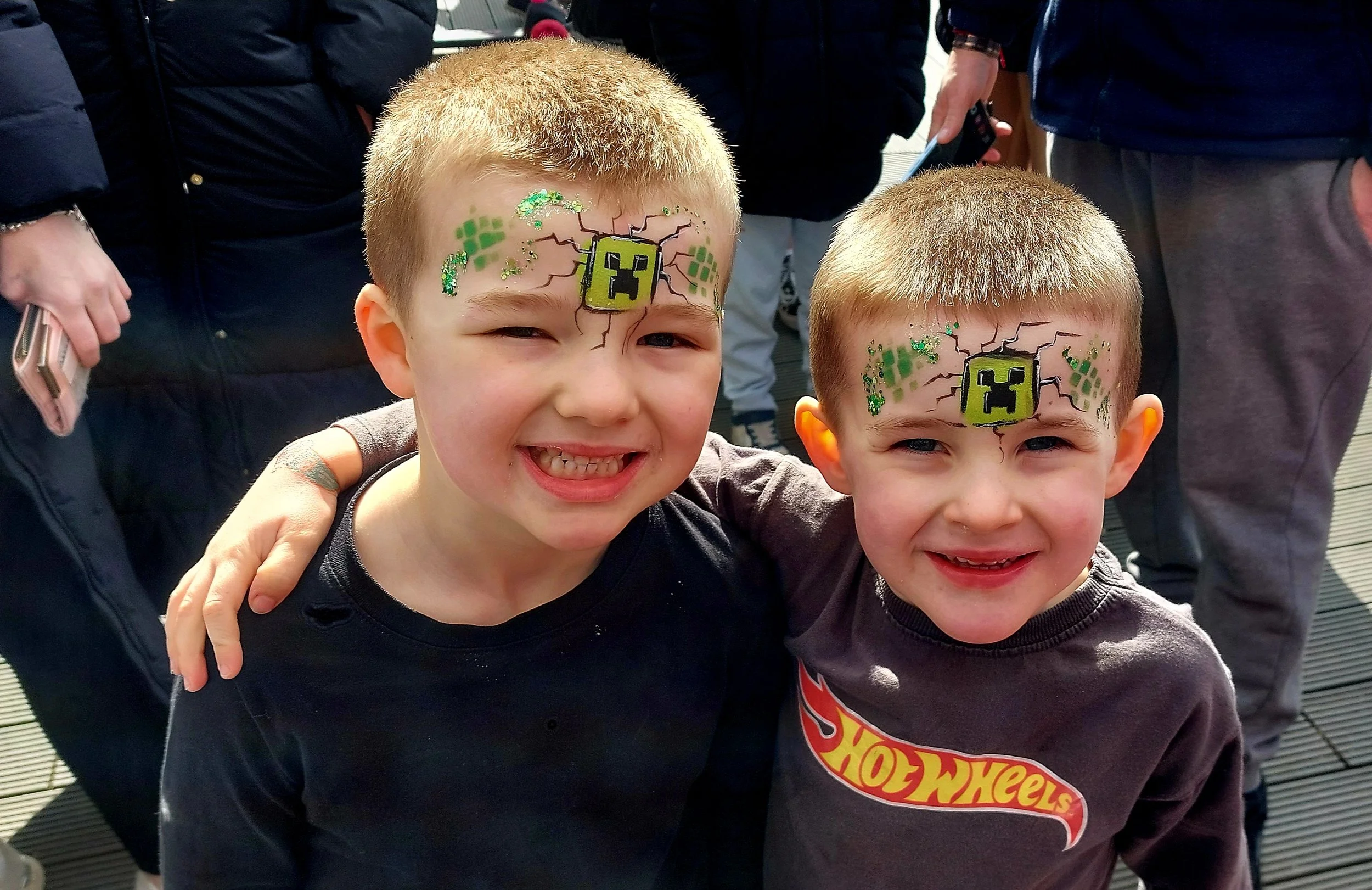 Boys with matching green Minecraft foreheads