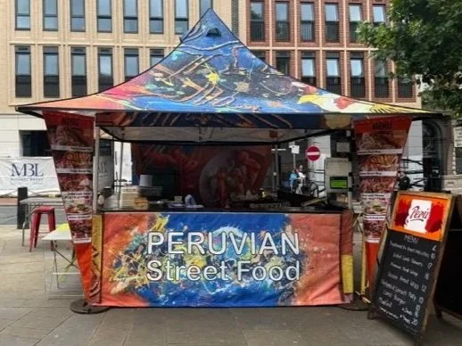 Peru stall - red and orange branding with white lettering