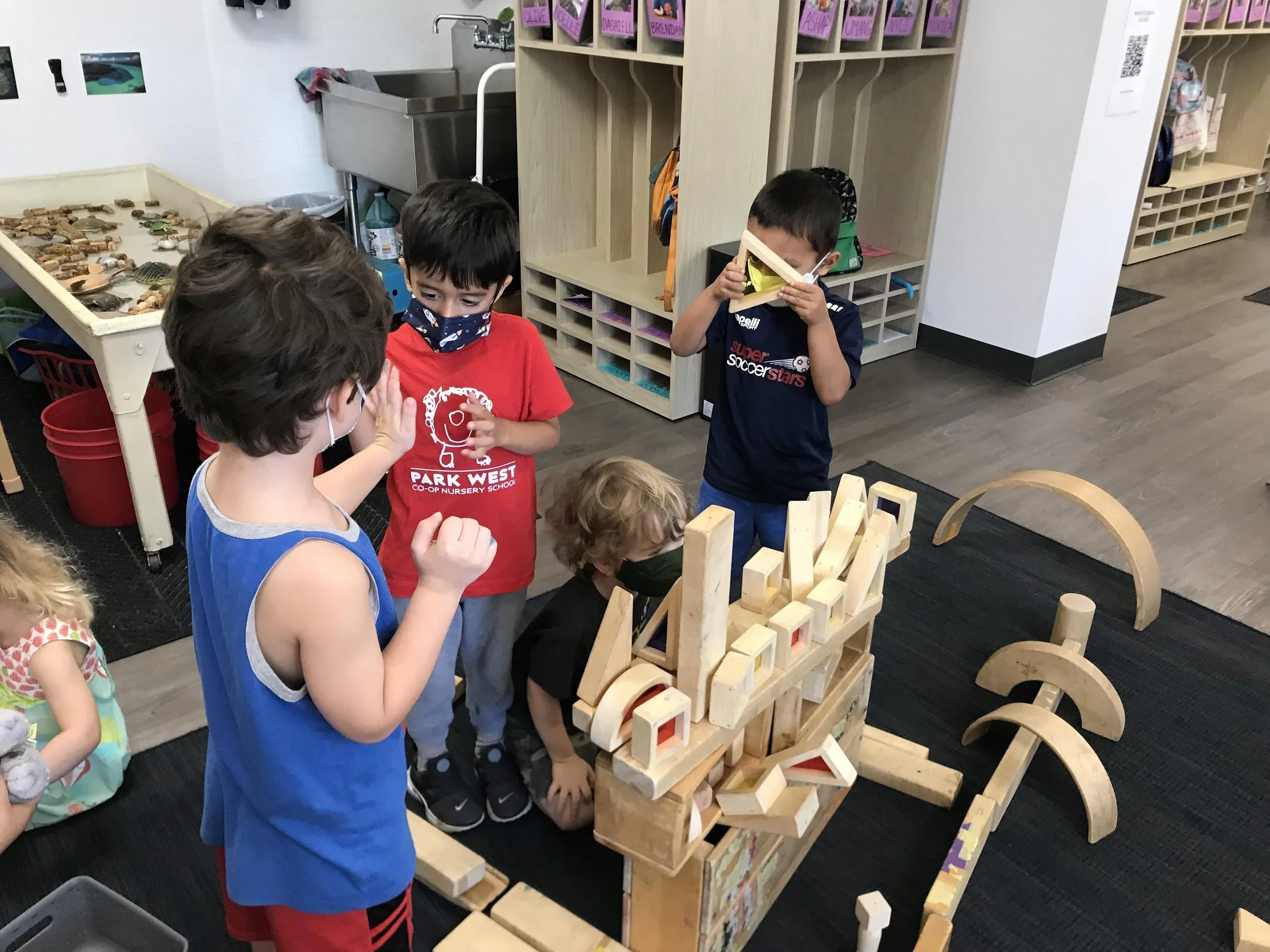   Teachers facilitated an interaction after a few kids seemed interested in offering some help, “You could ask: Where do I put this block?” “Oh, put it right here.” &nbsp; 