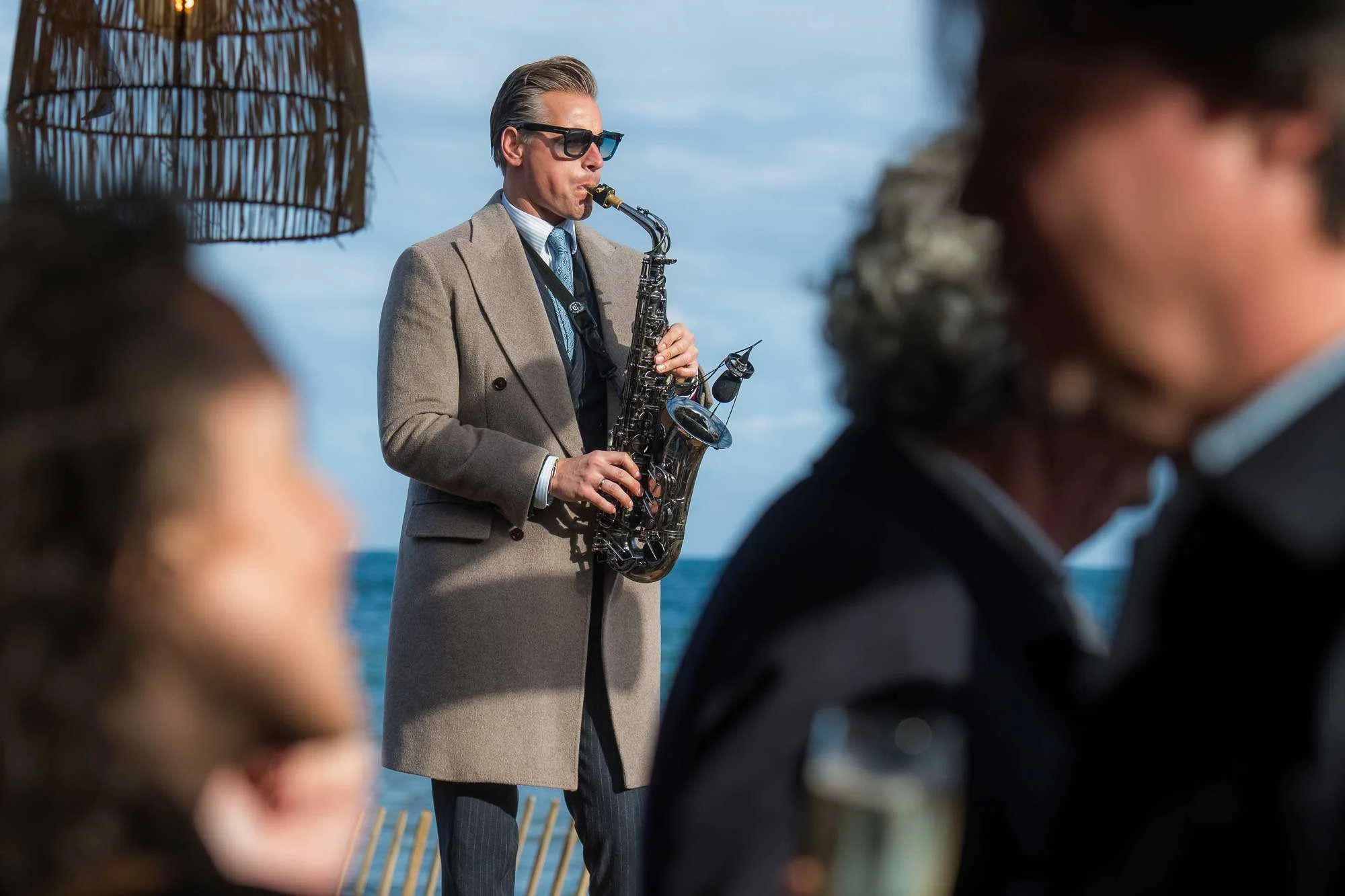 Sax player at MIPIM networking drinks, event photographer French Riviera