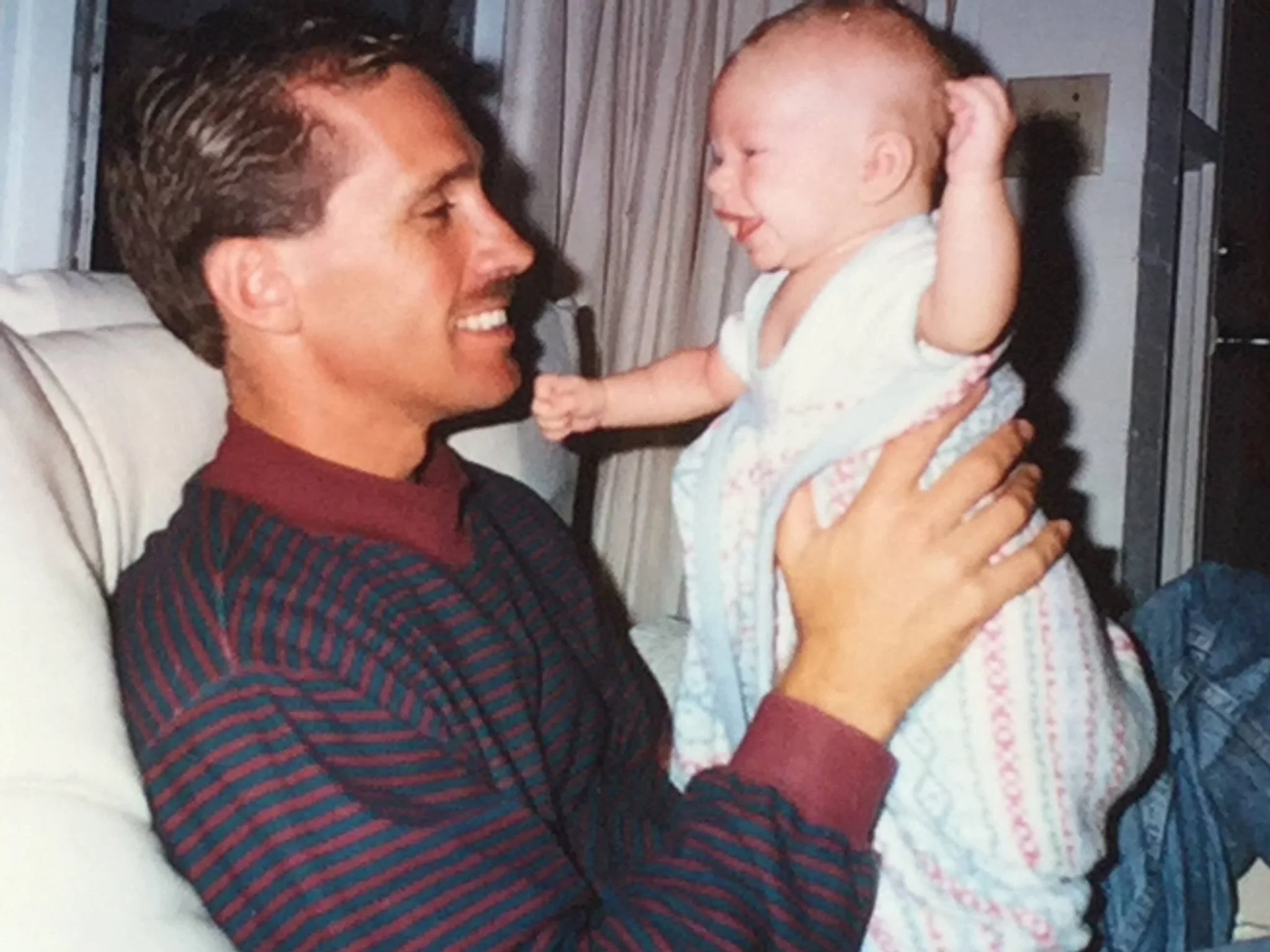 My dad holding me when I was tiny.