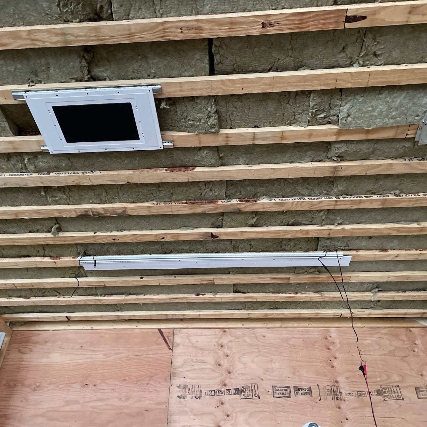 Getting the final pieces placed before the drywall goes in. Nakymatone hidden speakers are a must when obeying design rules. And for lighting, recessed track lighting is a winner. 💙

Don't clutter a beautiful ceiling with lots of fixtures and device