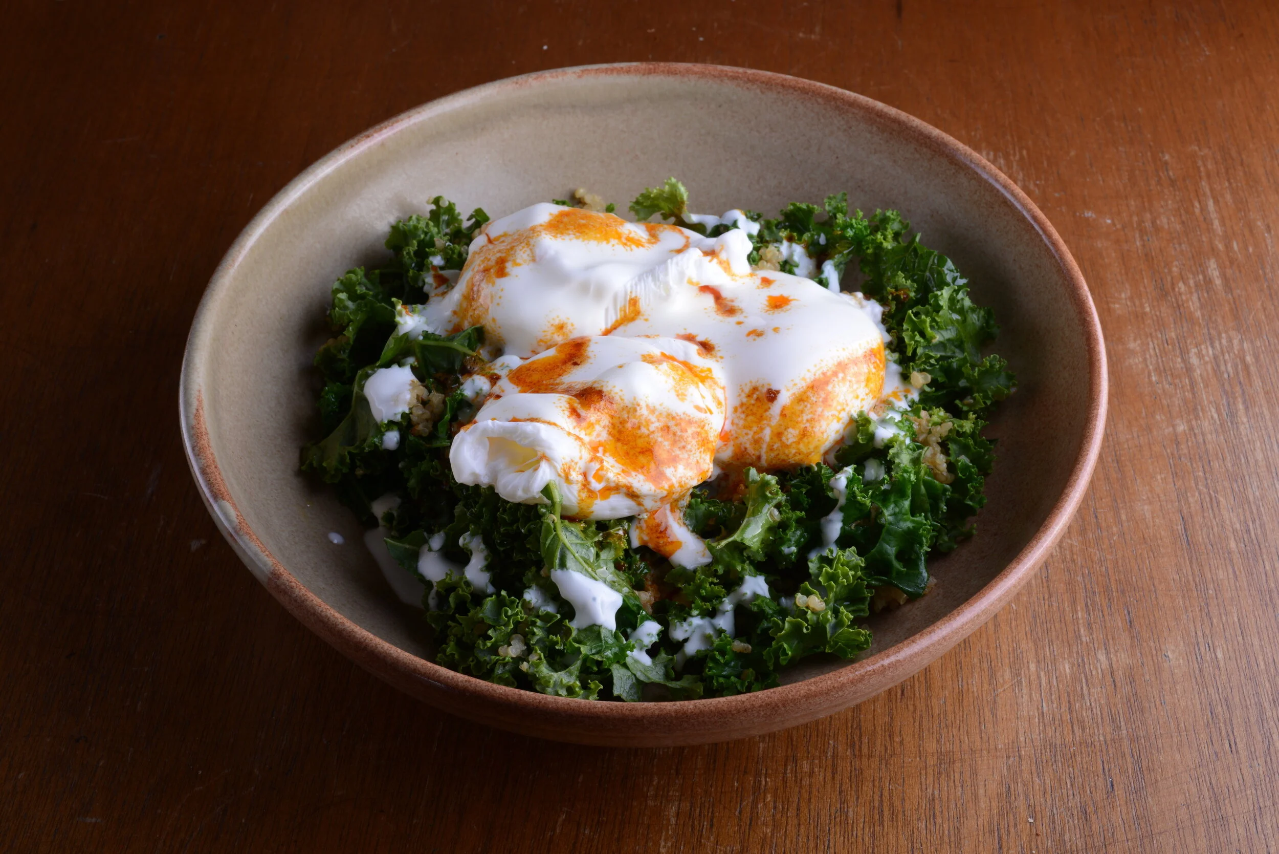 Garlicky Kale Salad with Poached Eggs