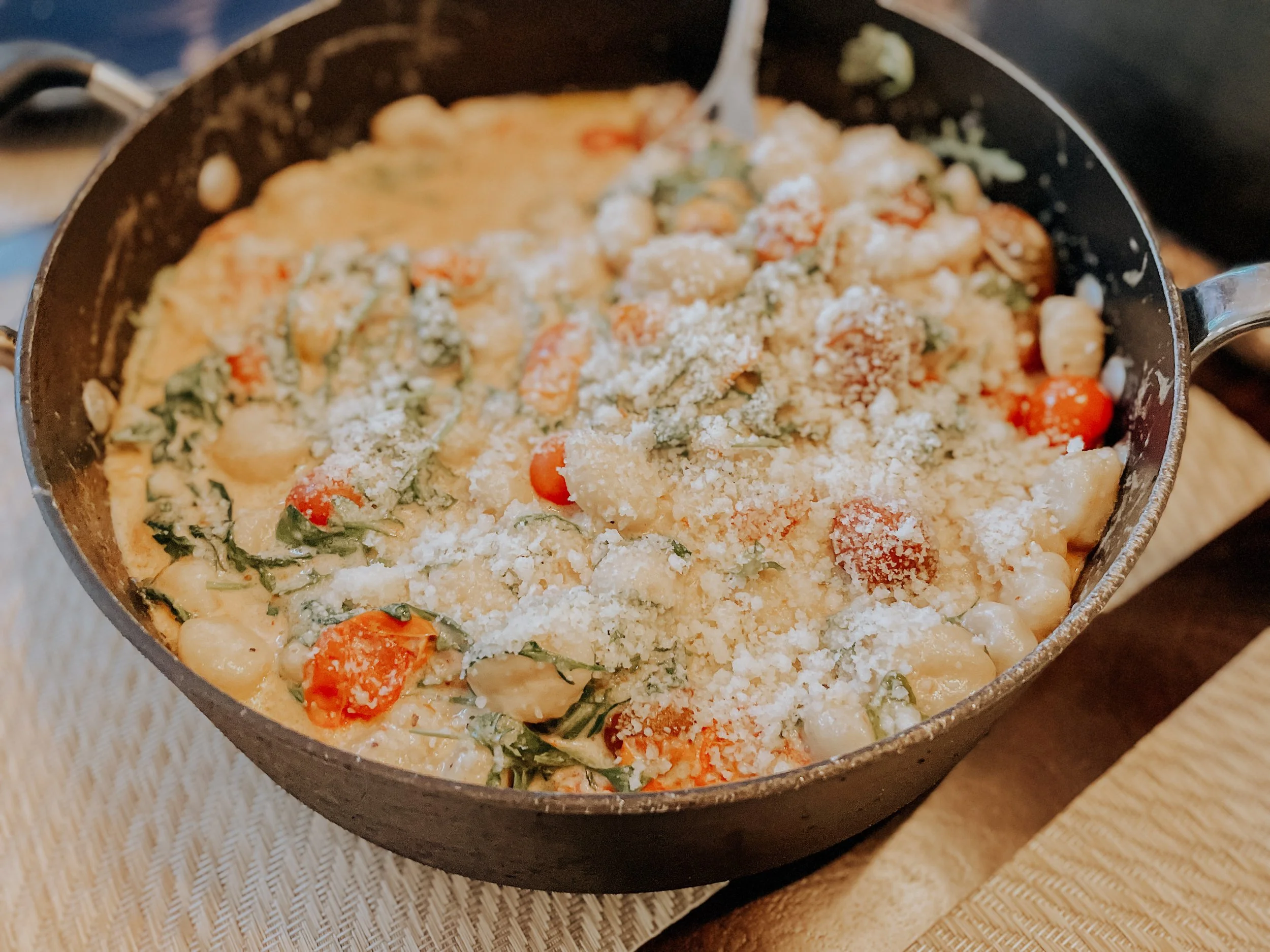 Cauliflower Gnocchi with Roasted Tomatoes and Arugula in a Creamy Alfredo Sauce