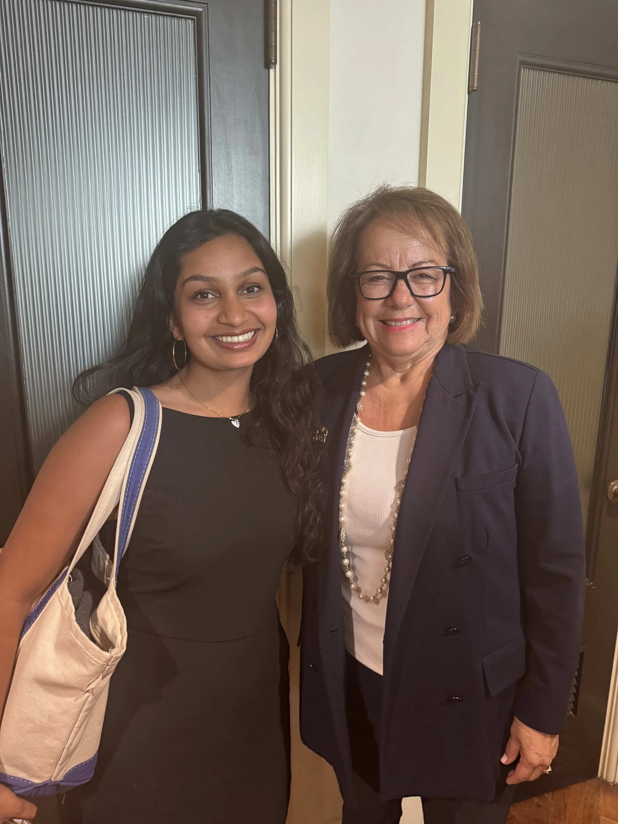 Riya Kumar stands with Senator Durazo