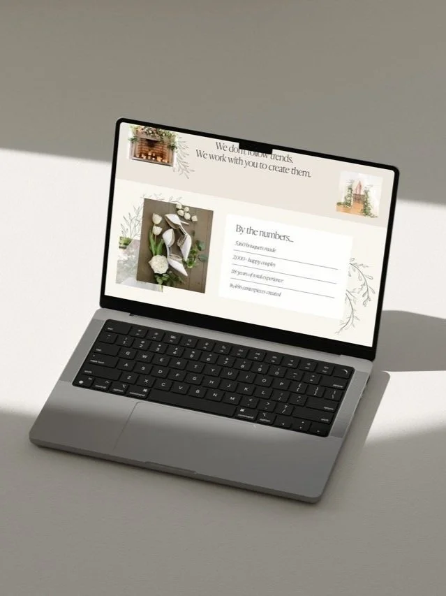 Open laptop displaying a webpage with floral and craft images and text about creating. The same webpage has a header and a section labeled 'By the numbers.'