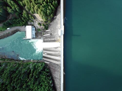 Birds-eye view on a big dam with the higher water level in the right side and the lower water level on the left..jpeg