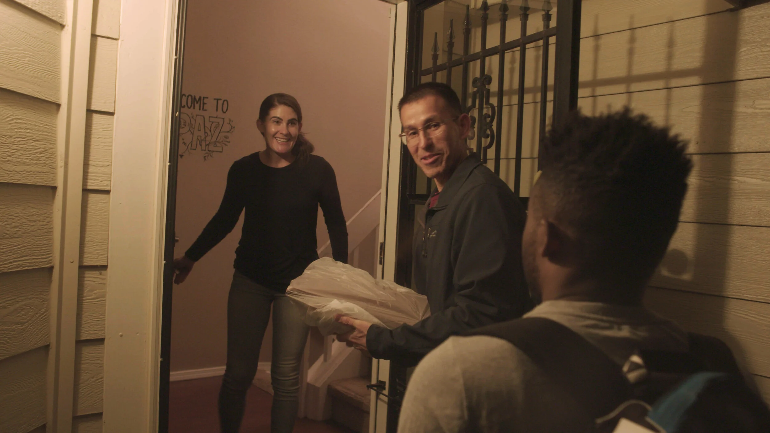 Sarah greets a new Casa de Paz guest.