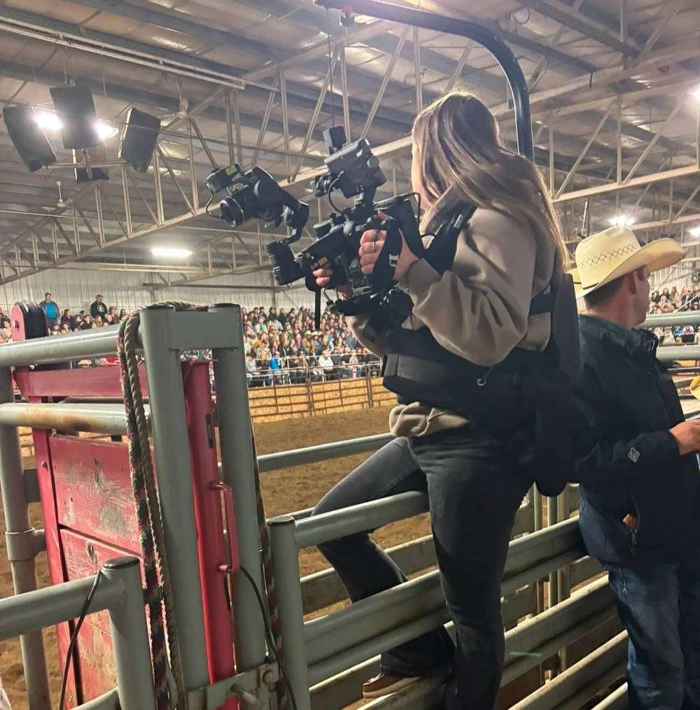 Taylor filming at a rodeo event