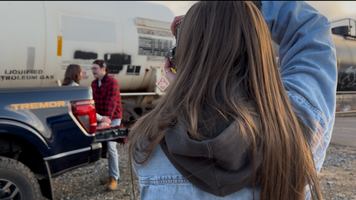 Behind the scenes photographing by a truck