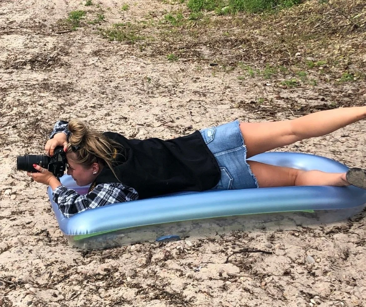 Taylor photographing outdoors with her camera