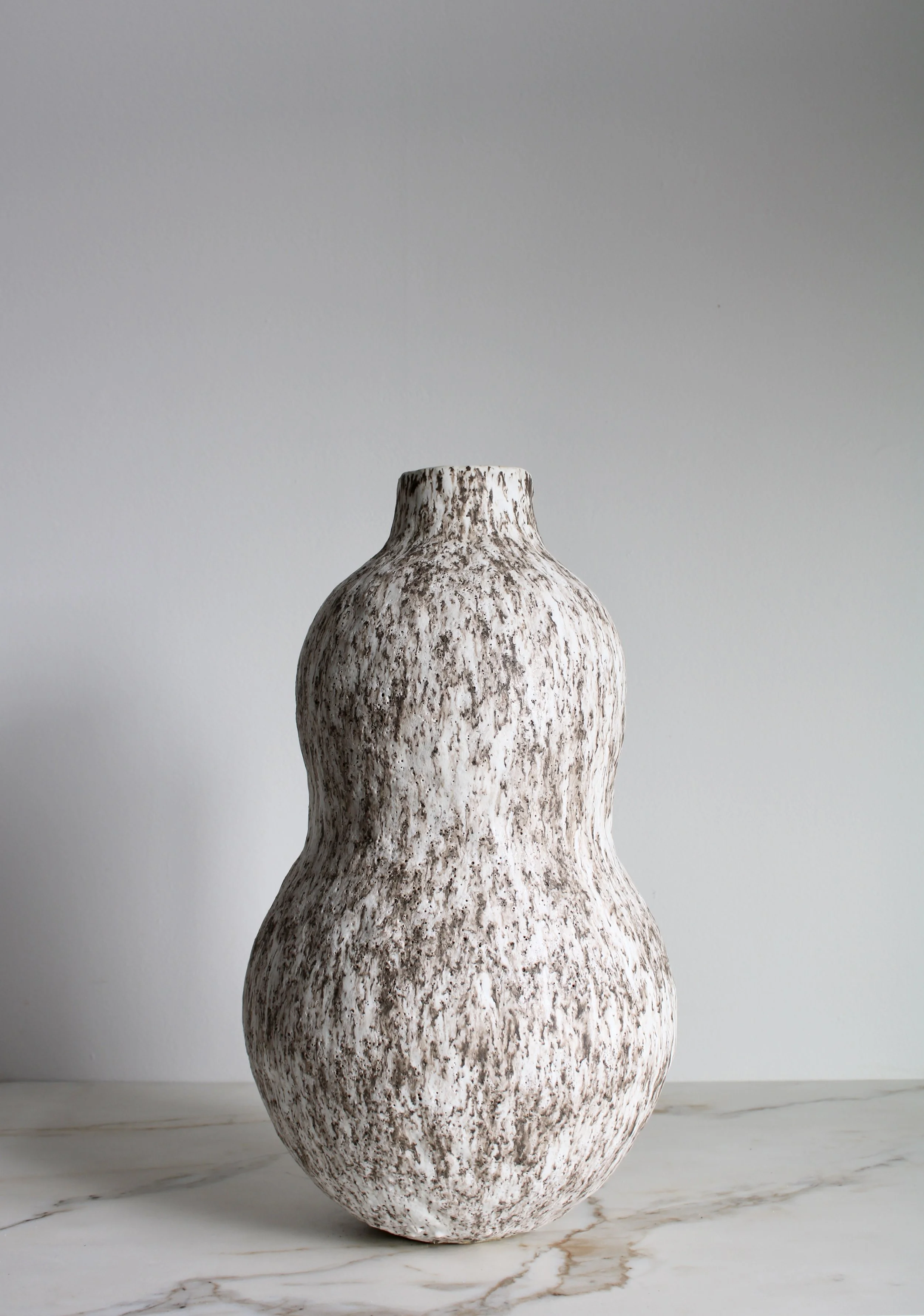 Speckled White Double Curve Bottle