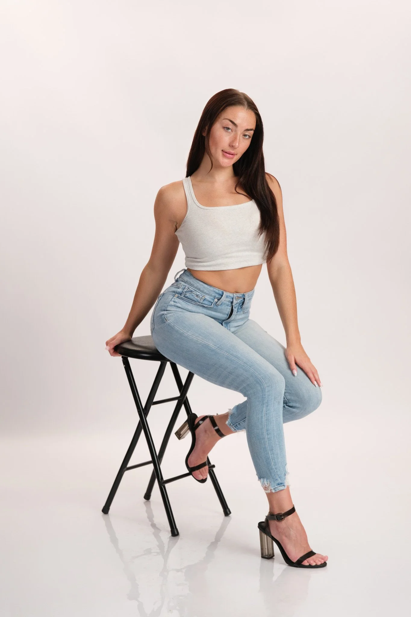 Women's model digital, neutral expression, studio light
