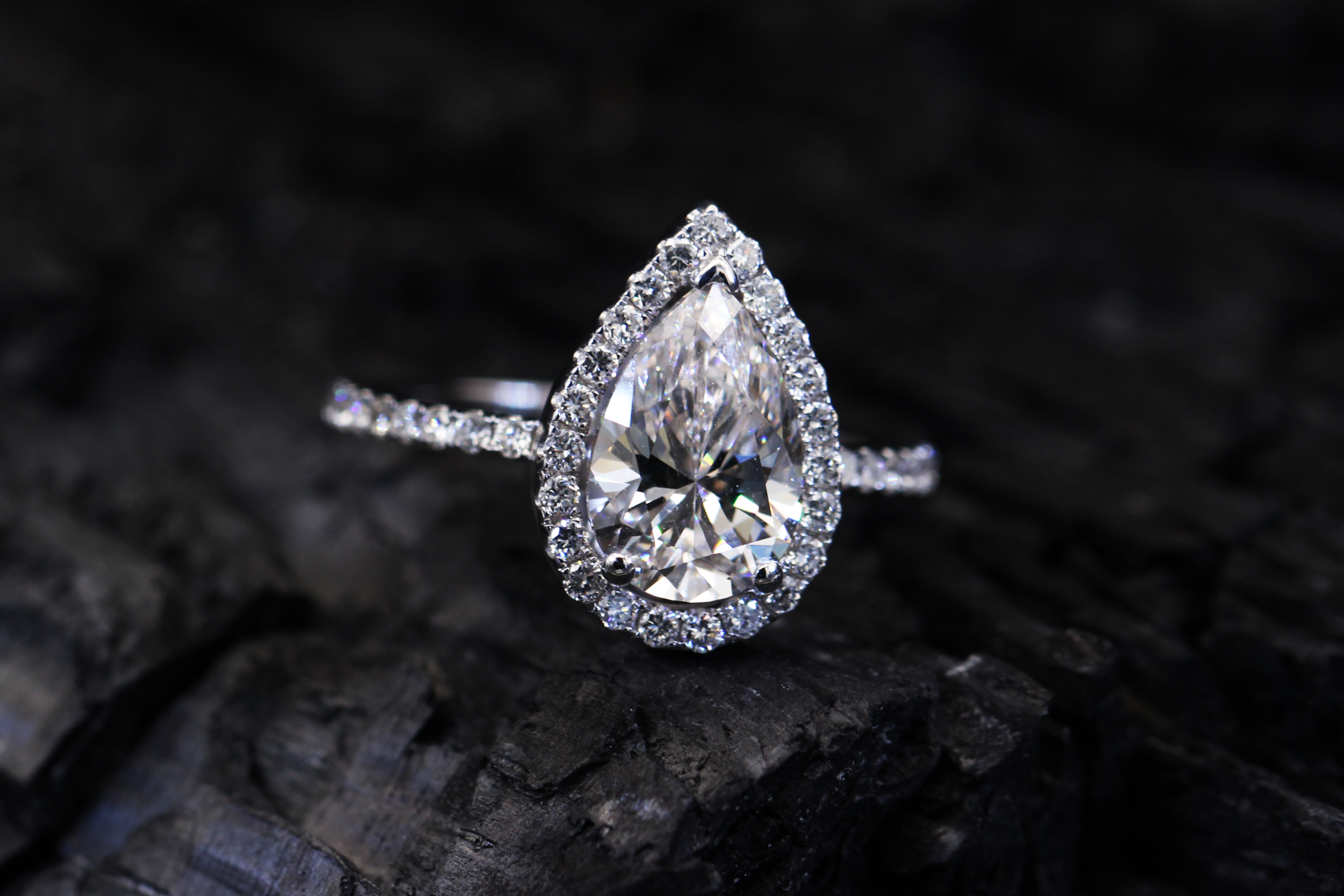 Halo pear shaped diamond ring sagess