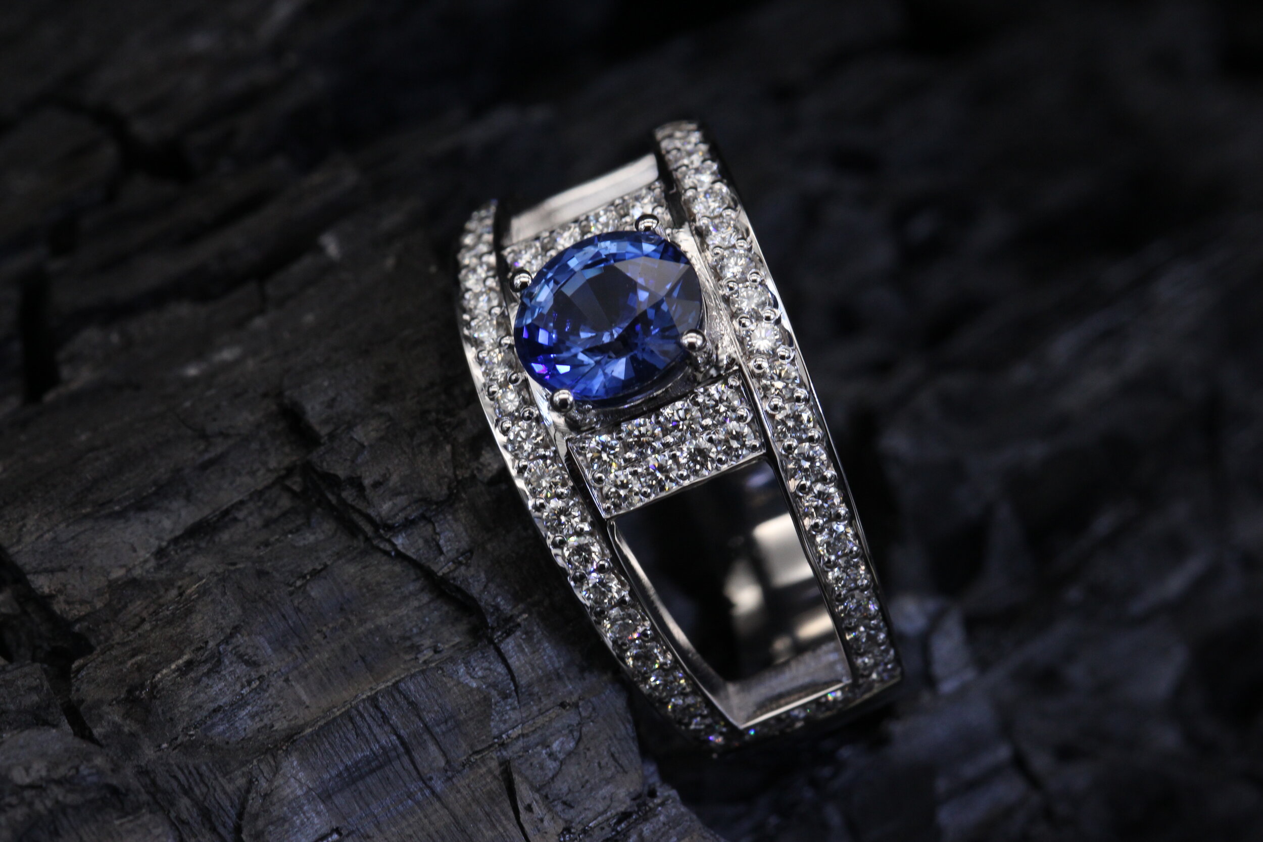 Gold ring paved with diamonds and set with a  vibrant blue Ceylon sapphire.
