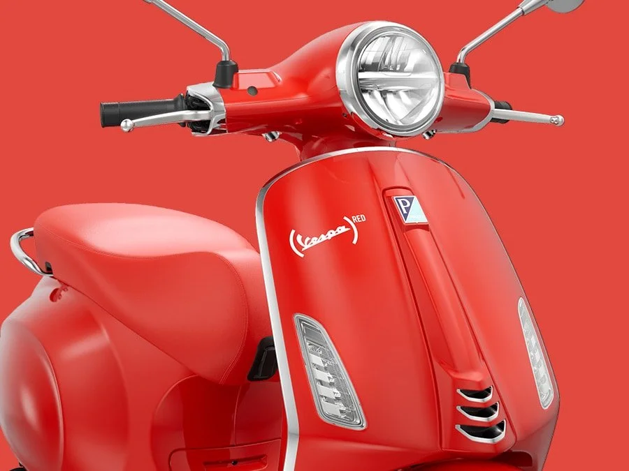 2026 Vespa Primavera 150 scooter in Red — three-quarter rear view 4