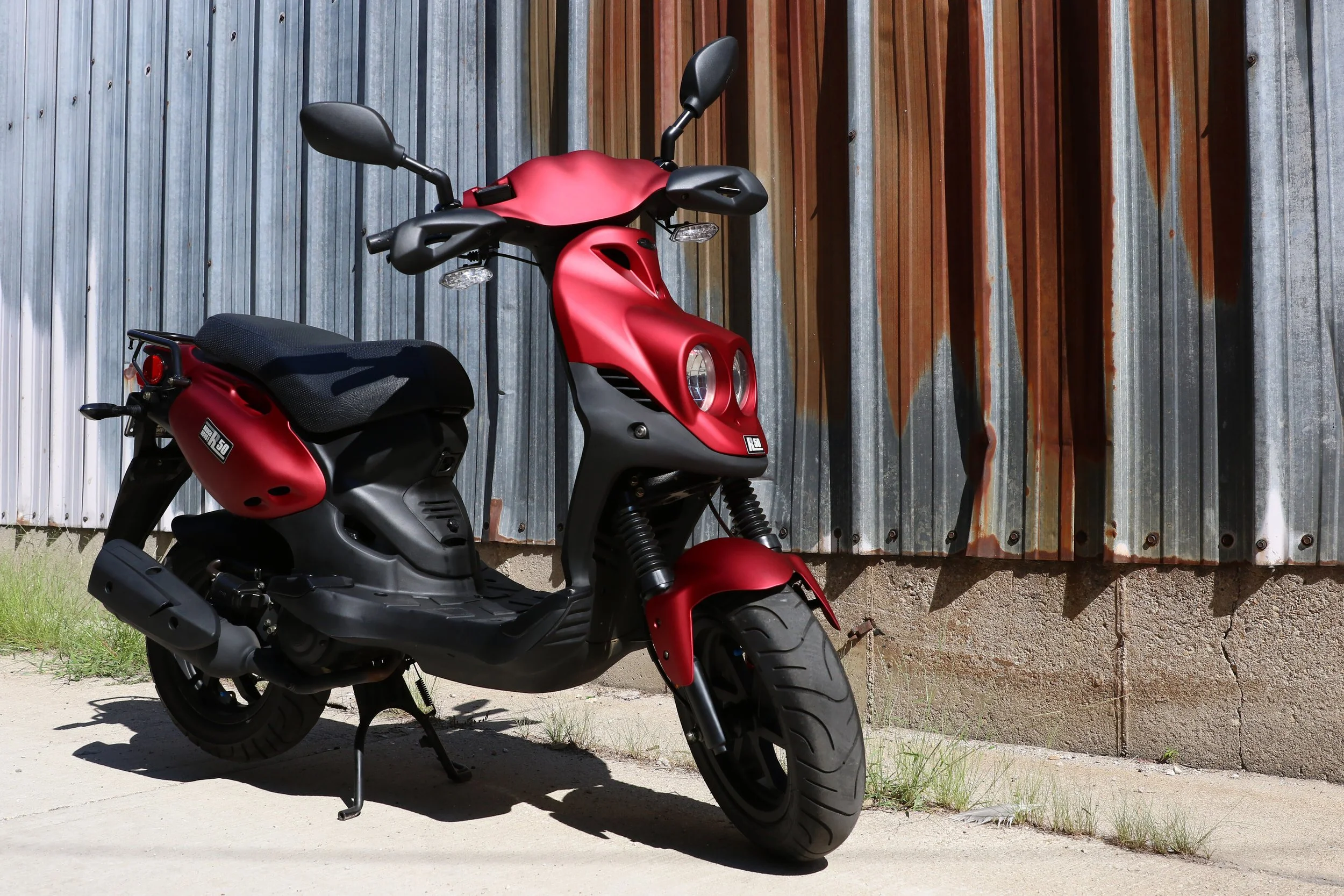 2026 Genuine RoughHouse 50 Sport scooter in Red — full-length studio view 3