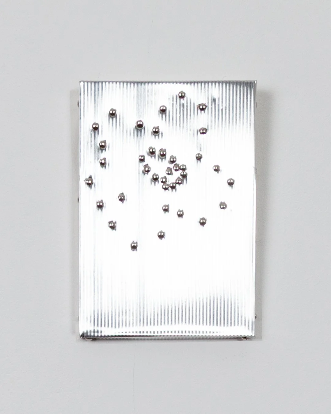 Rita Osipova, Narcissus , corrugated metal, plywood, nails, 15cm x 10cm x 1.2cm, 2025