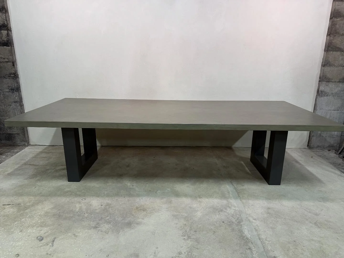 Headed from one coast to the other&hellip;this 10&rsquo; hand troweled custom concrete table is the perfect combination of iron and stone✨ #custom #customtable #concretetable #diningtable #concretediningtable #outdoortable #table #customfurniture #cu