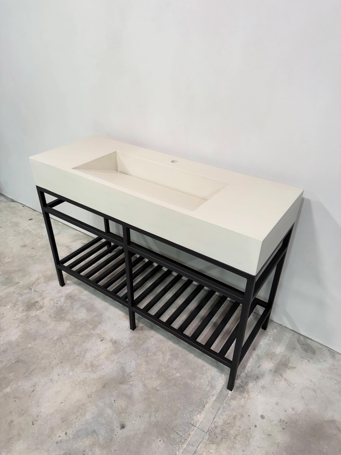 Clean lines, bold presence-our ramp vanity sink in natural white on a custom steel base. #concretesink #bathroomdesign #interiordesign #stogsconcretedesign #shipsnationwide