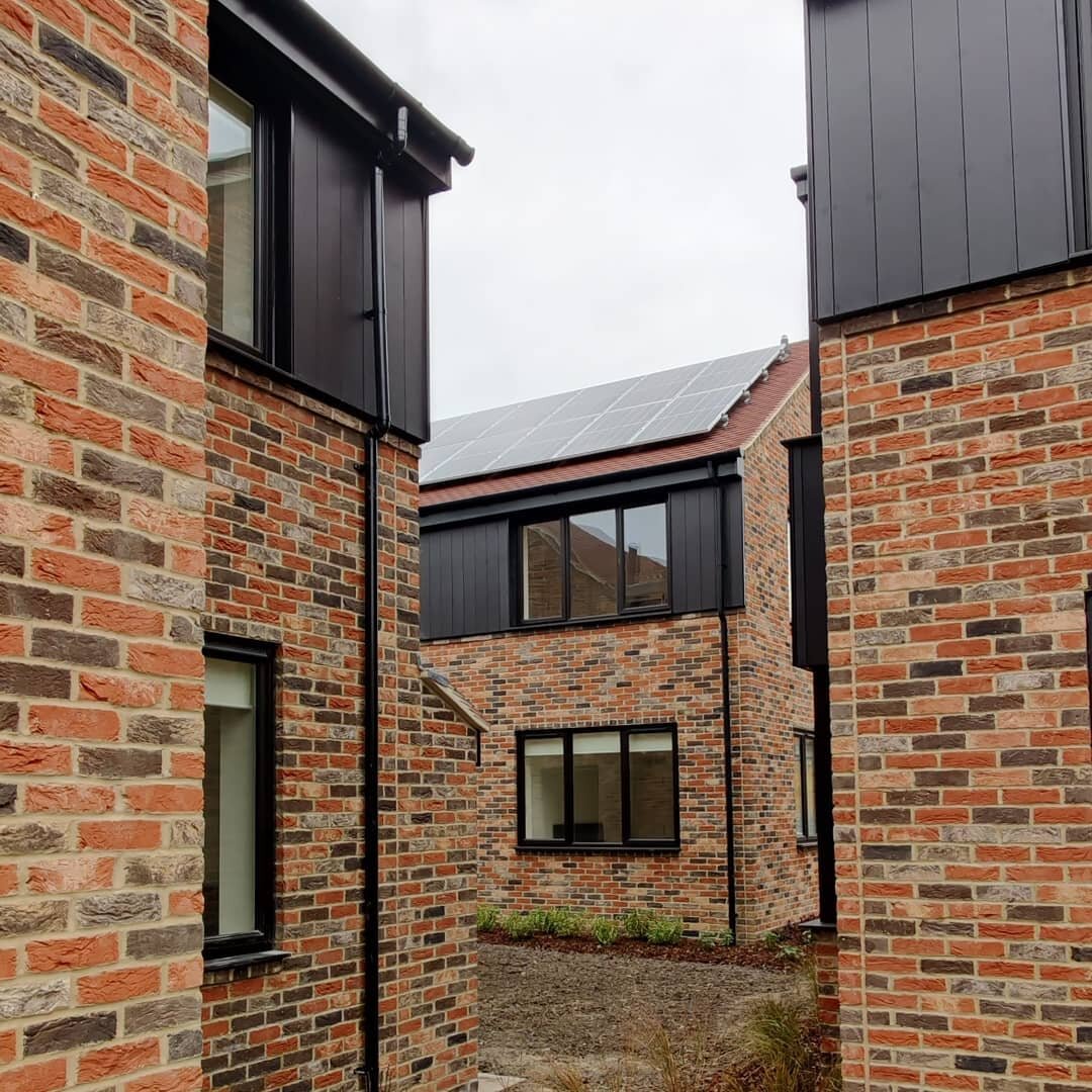 A glimpse between the new buildings at our recently completed affordable housing project at Bookbinders Cottages.
&middot;
The brickwork is a unique mix of two different types to compliment the original cottages on the site dating from 1927. The blac