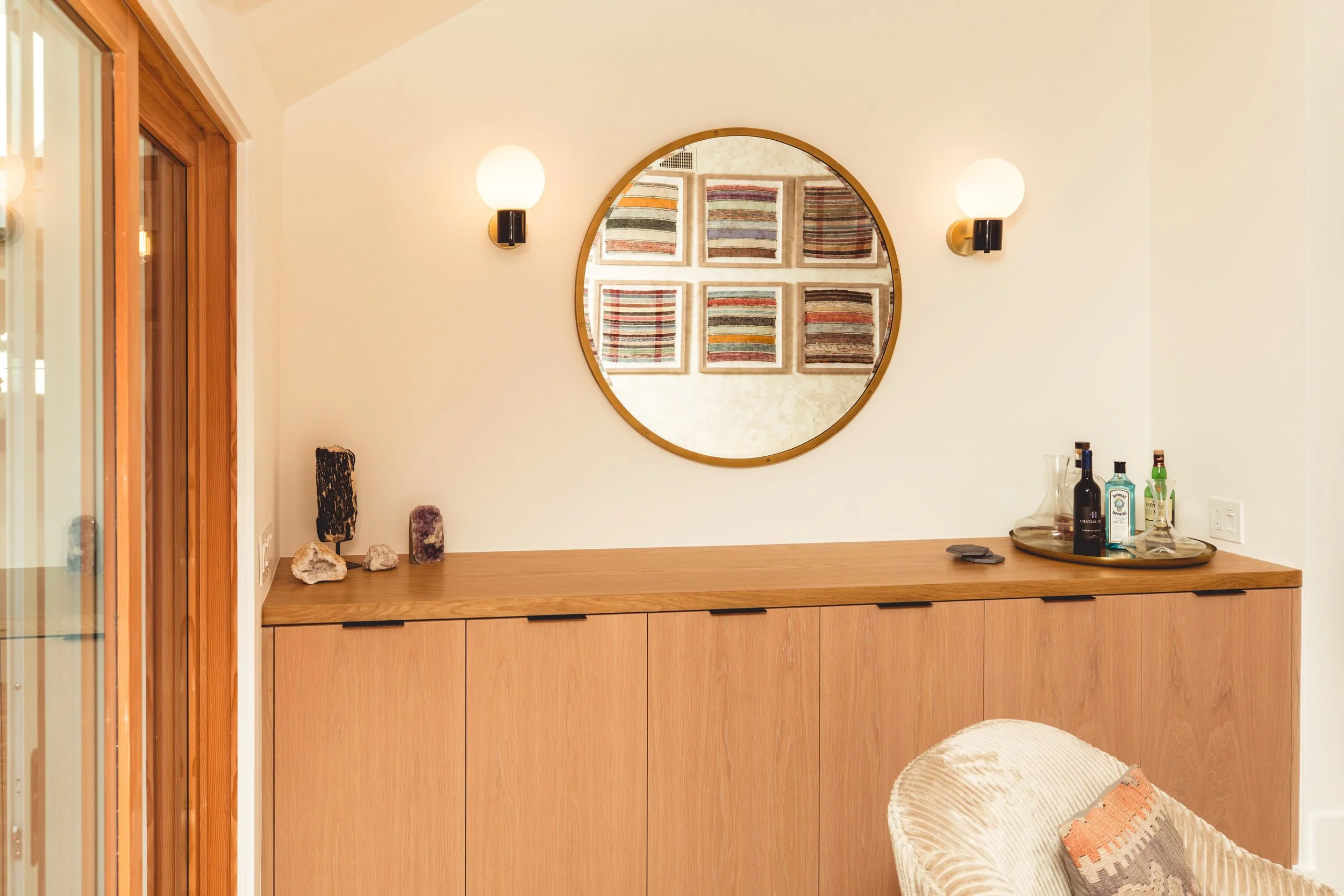 RobertGuy_LivingRoom_BuiltInCabinet_CircleMirror 2.JPG