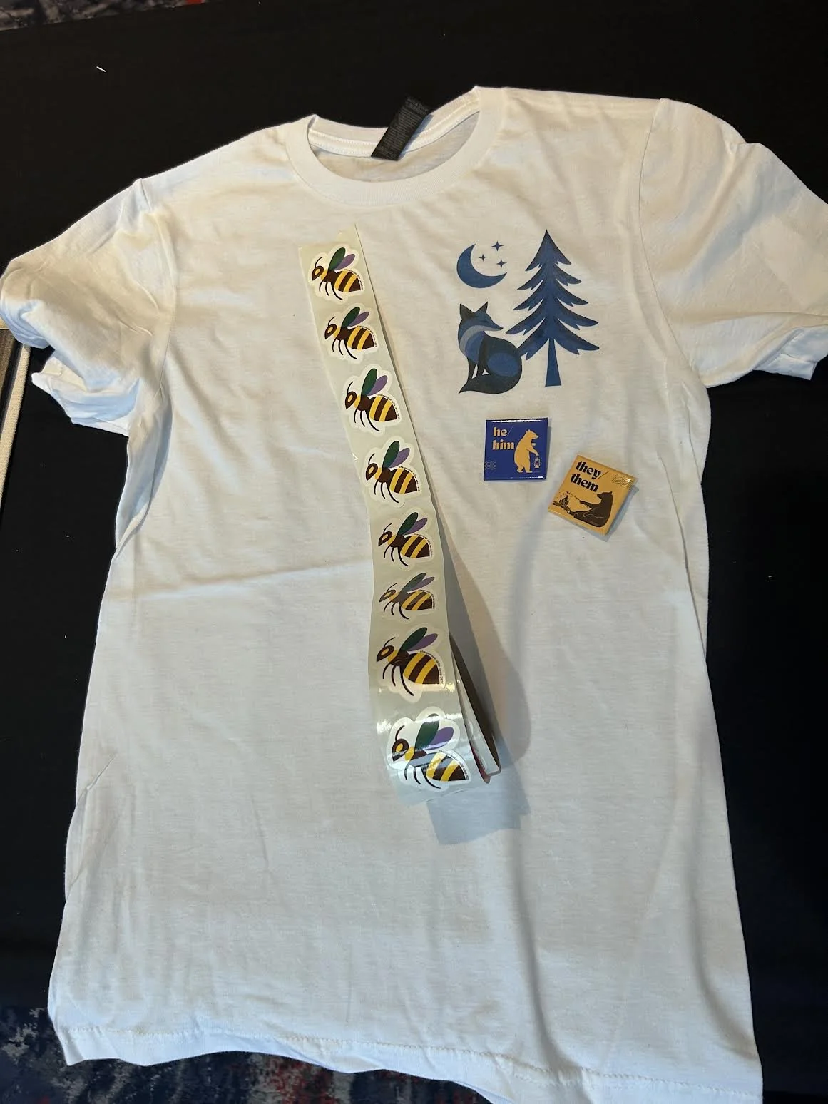 T-shirt, sticker, and pronoun pin designs created for Changemaker Skills Camp 2025