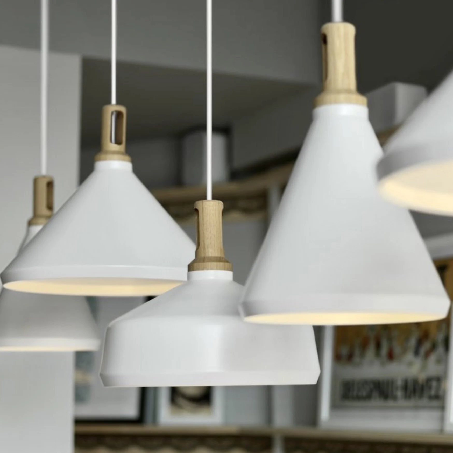 Paul Crofts Nonla pendants are a modern interpretation of an industrial fitting. The Nonla pendant lights are a series of three variations of a conical shape, crafted from powder coated spun aluminium with CNC turned oak tops