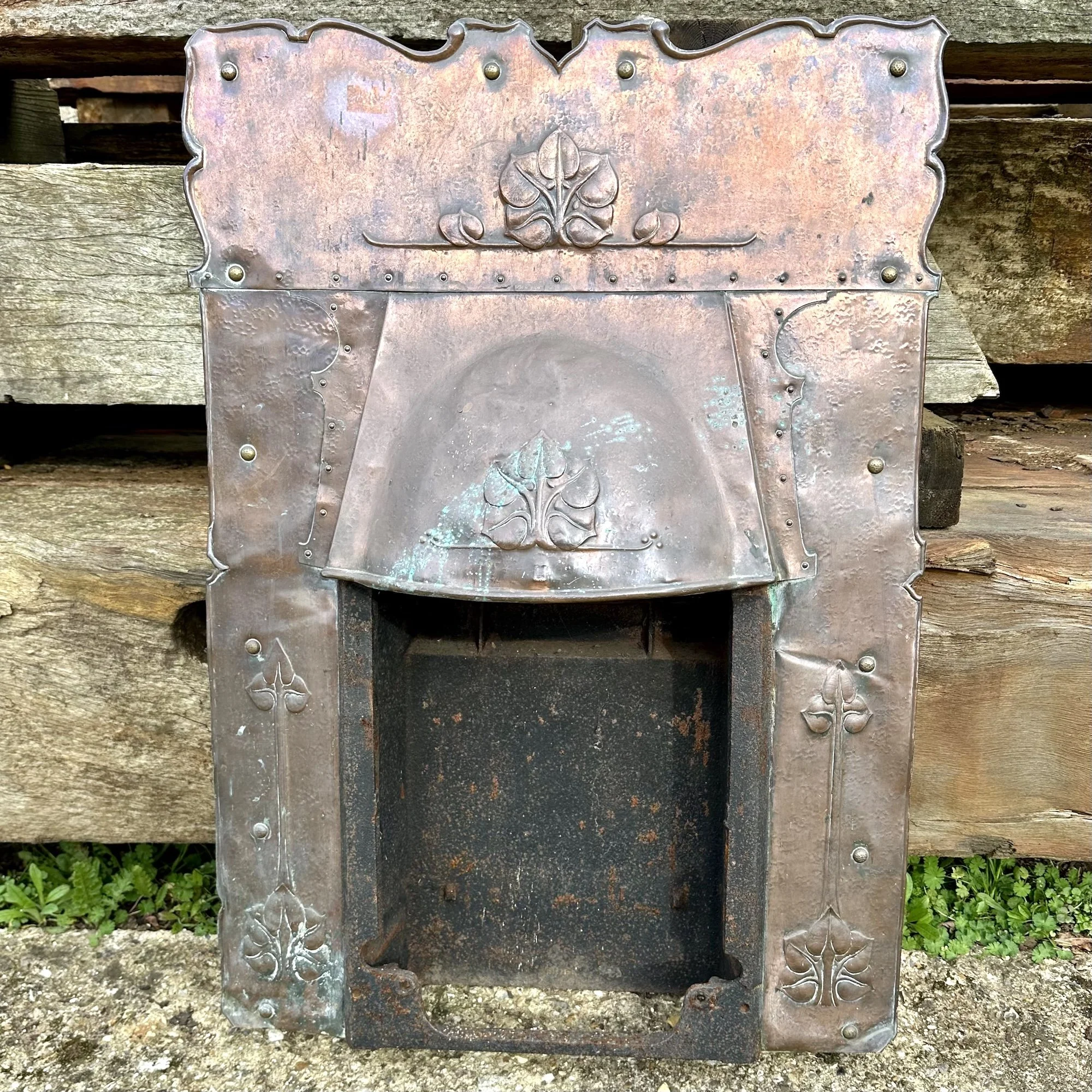 Antique Art Nouveau copper fire surround.