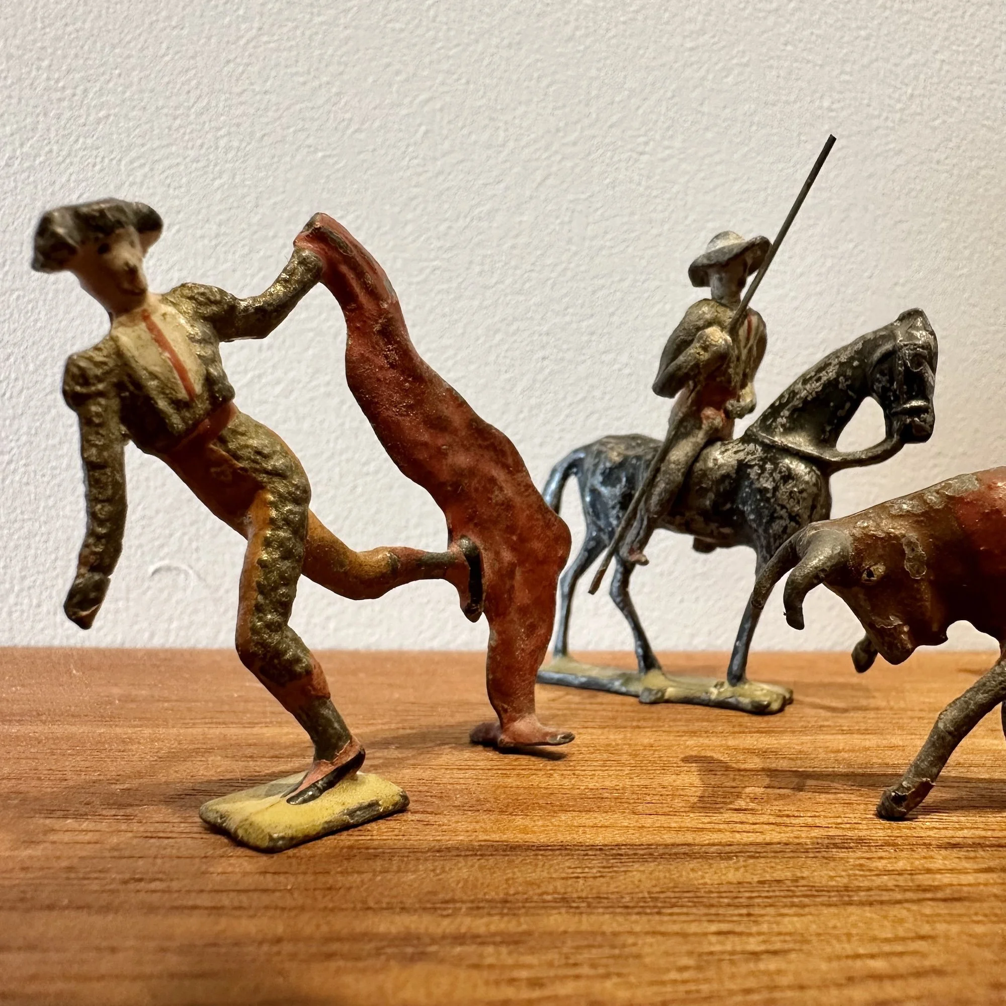 Group of 8 Antique Heyde Bull Fight Figures.  2 Matadors, 3 Subalternos, a Goring Bull and a mounted Picador.