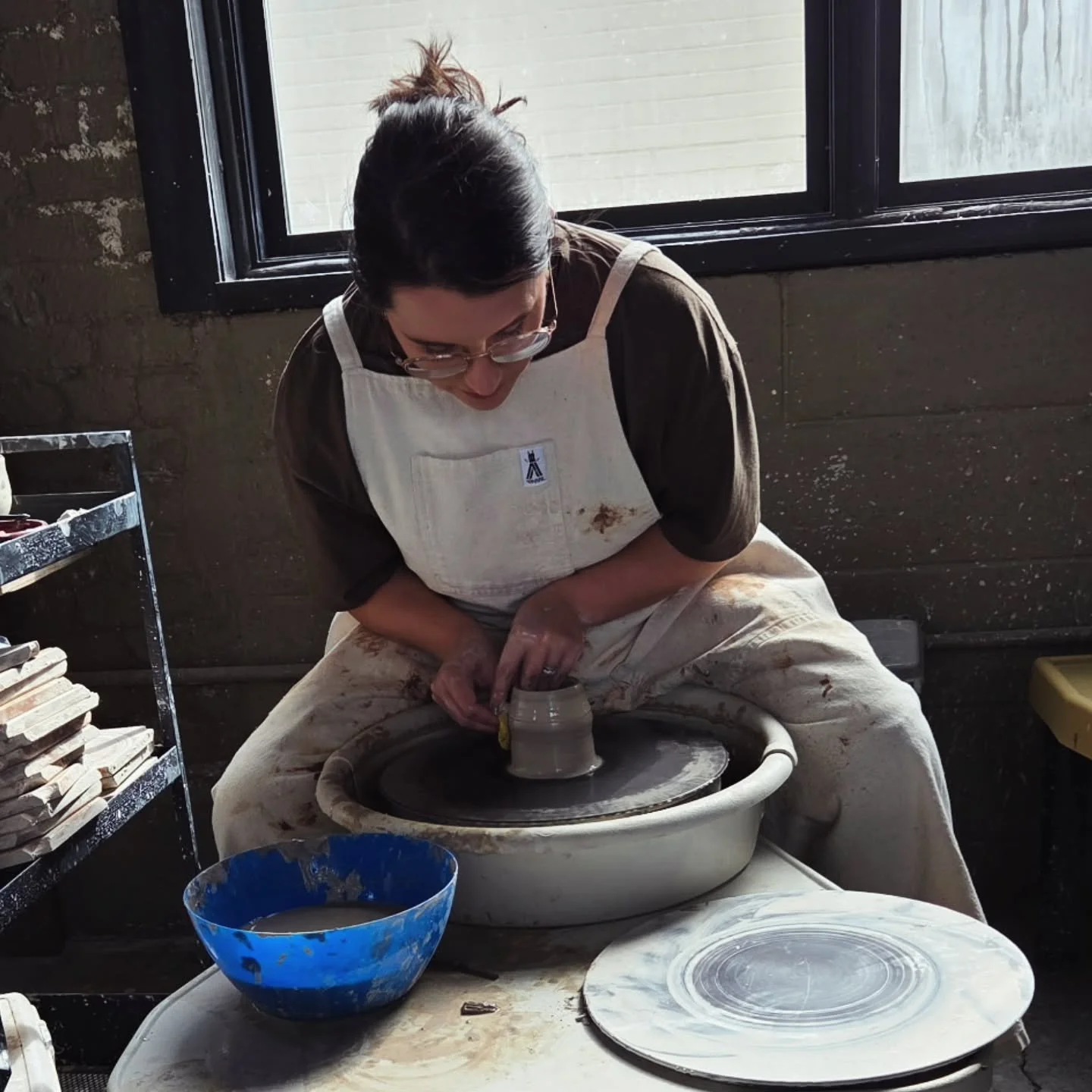 A rare photo of myself in action. We had a super fun private birthday party today and I absolutely loved teaching them how to throw on the wheel! 
Private classes are always available for booking @mudslingers.pottery so if you are interested in takin