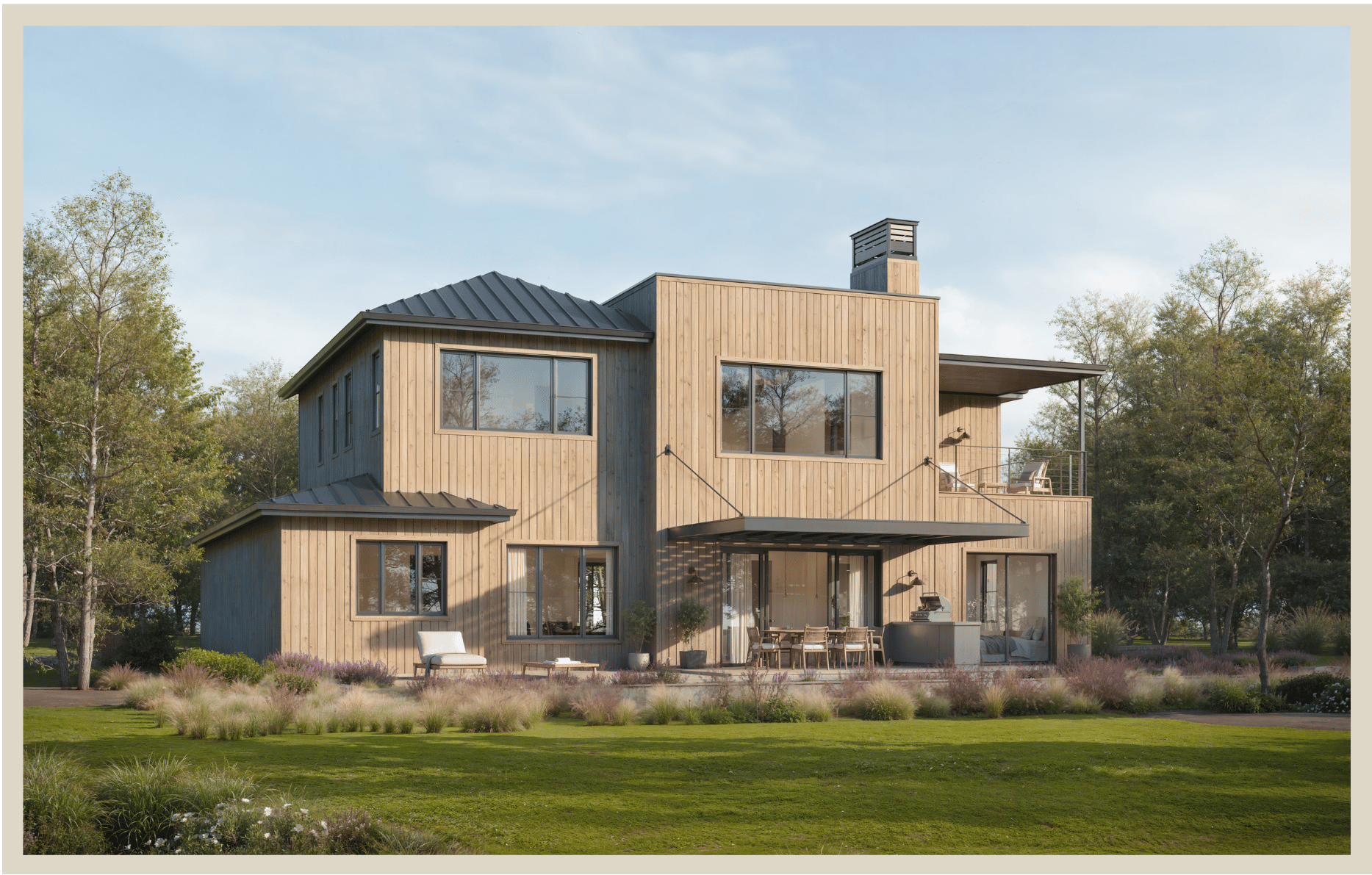 Modern multi-story house with natural wood exterior, large windows, and outdoor patio seating, set in a landscaped yard with trees and shrubs under a blue sky.