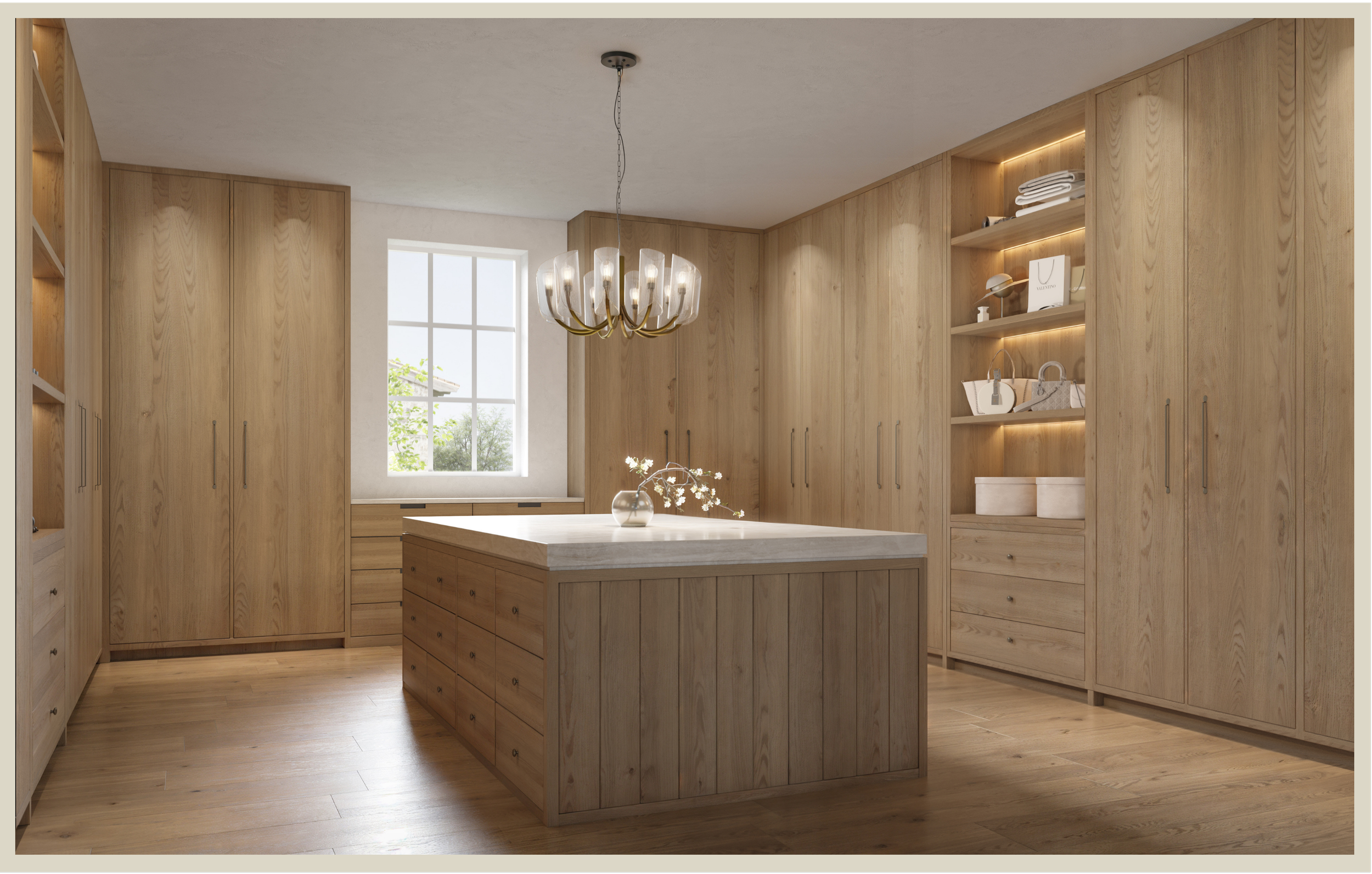 A modern kitchen with wooden cabinets, a kitchen island with a white marble top, a chandelier, and a window with trees outside.