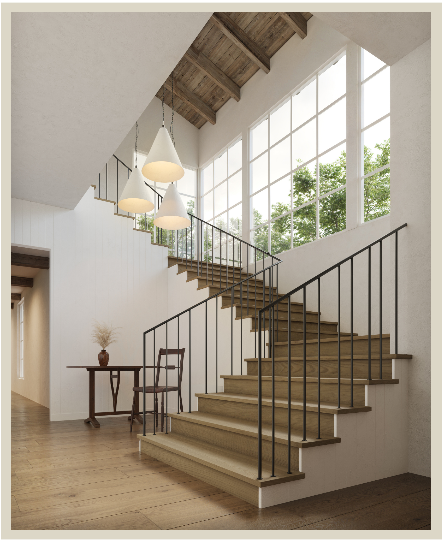 An interior stairway with wooden steps, black metal railings, and a wall of large windows showing greenery outside. There is a small table with two chairs and a decorative vase with dried plants to the left of the stairs.
