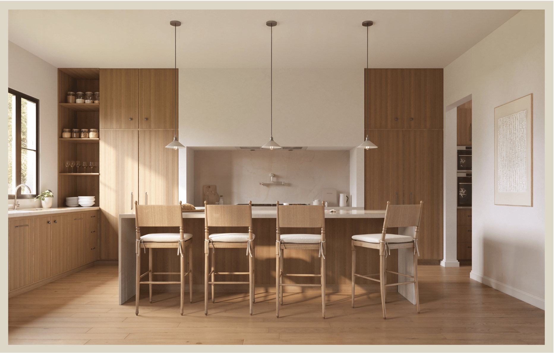 Kitchen with wooden cabinets, a large white kitchen island with four chairs, pendant lights overhead, and a window on the left. There's a built-in oven and open shelves with jars and glassware.