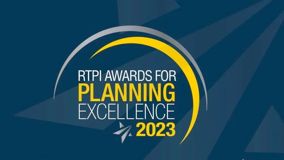 Logo for RTPI Awards for Planning Excellence 2023, featuring a dark blue background with a yellow curved line and white text.