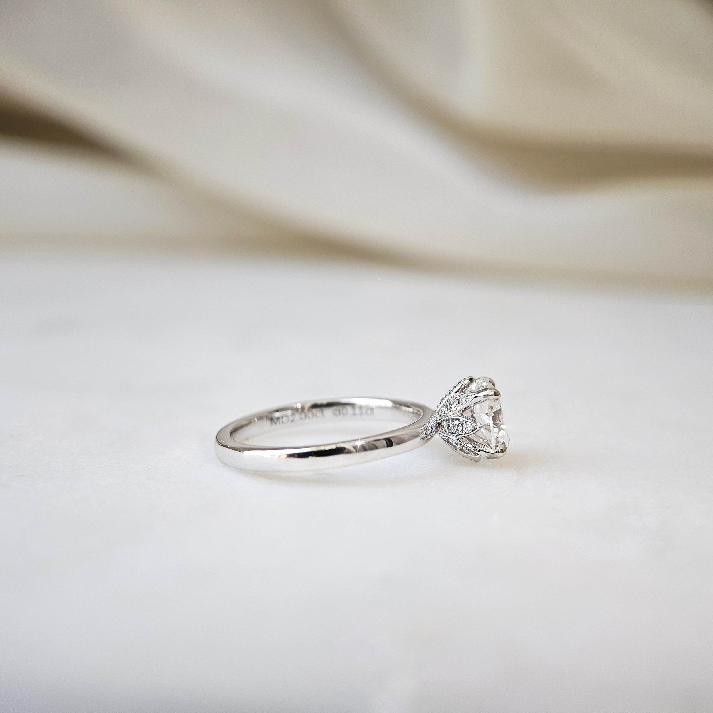 IGI775631866-The Lotus Round Diamond Ring-03.jpeg