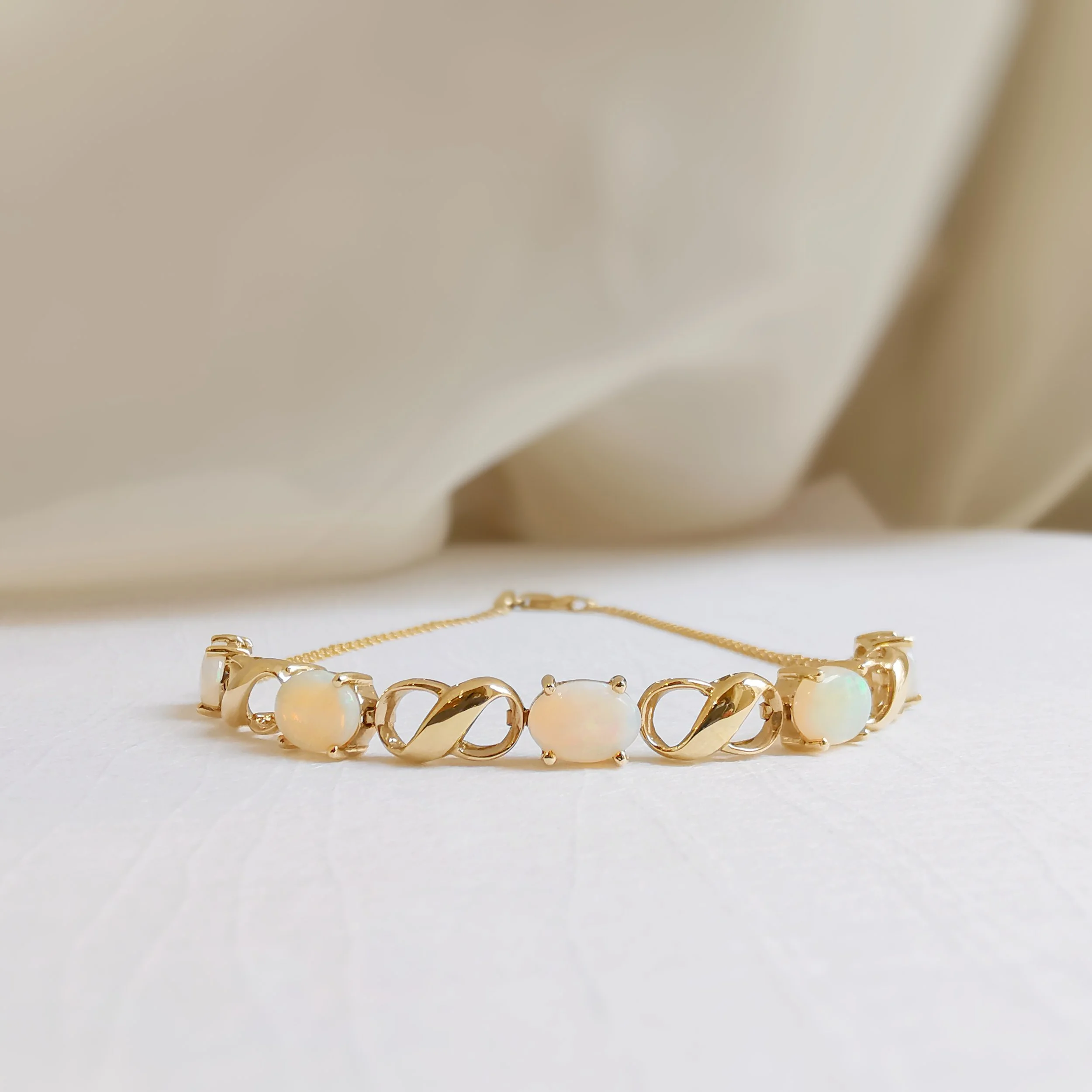 Studded Infinity White Opal Bracelet