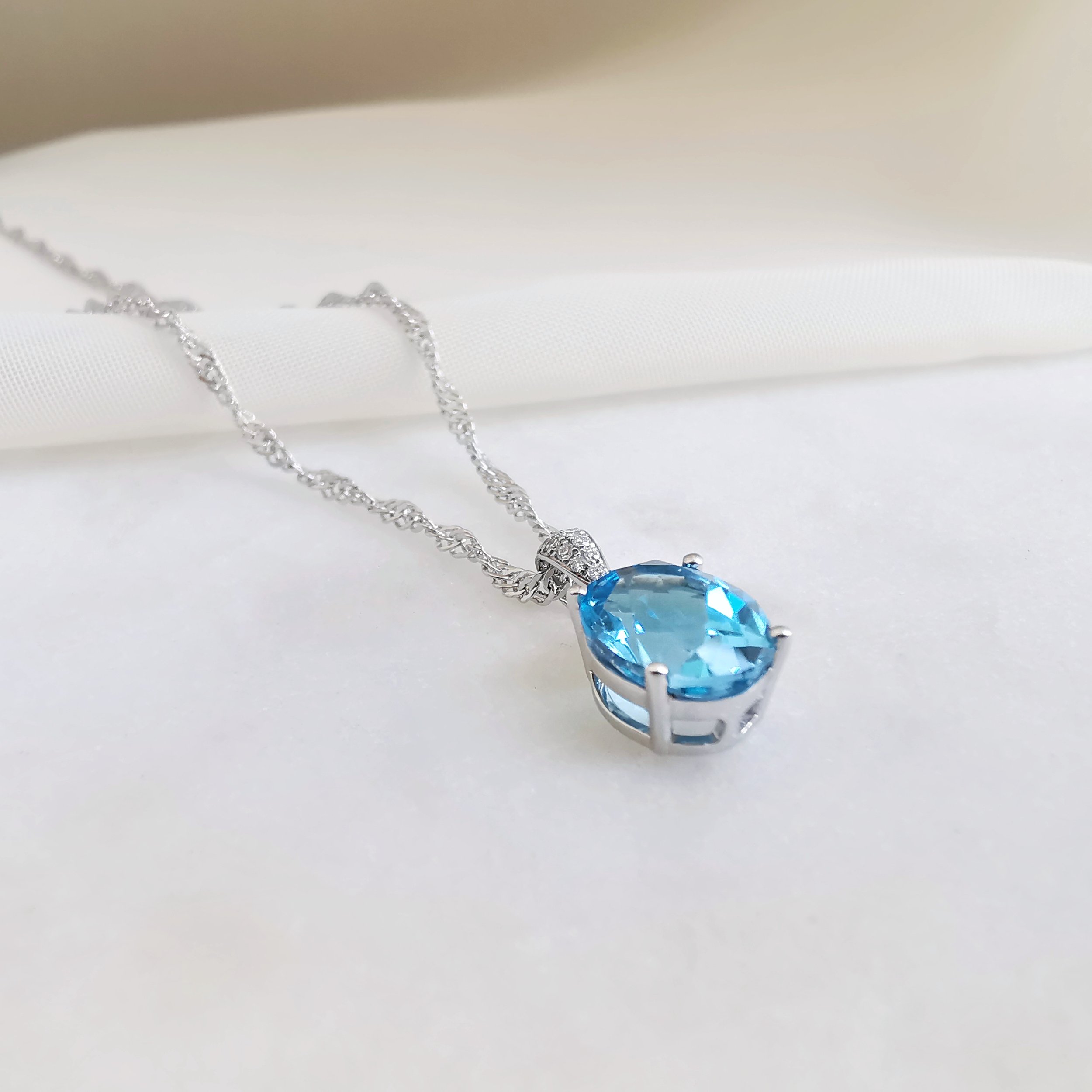 18K Cascade Blue Topaz Pendant with Diamond 4.jpeg
