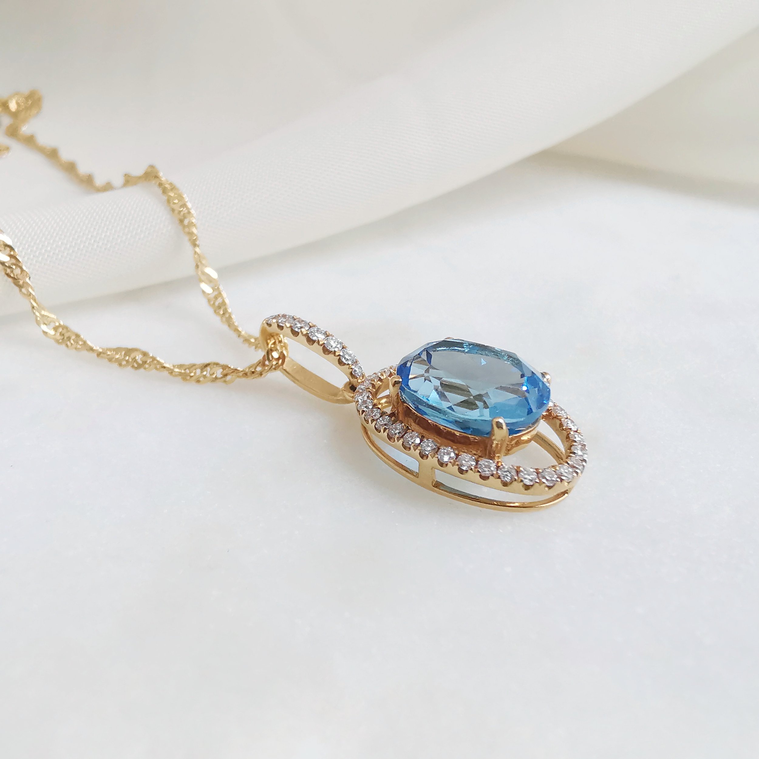 18K Mille Blue Topaz and Diamond Pendant 4.jpeg
