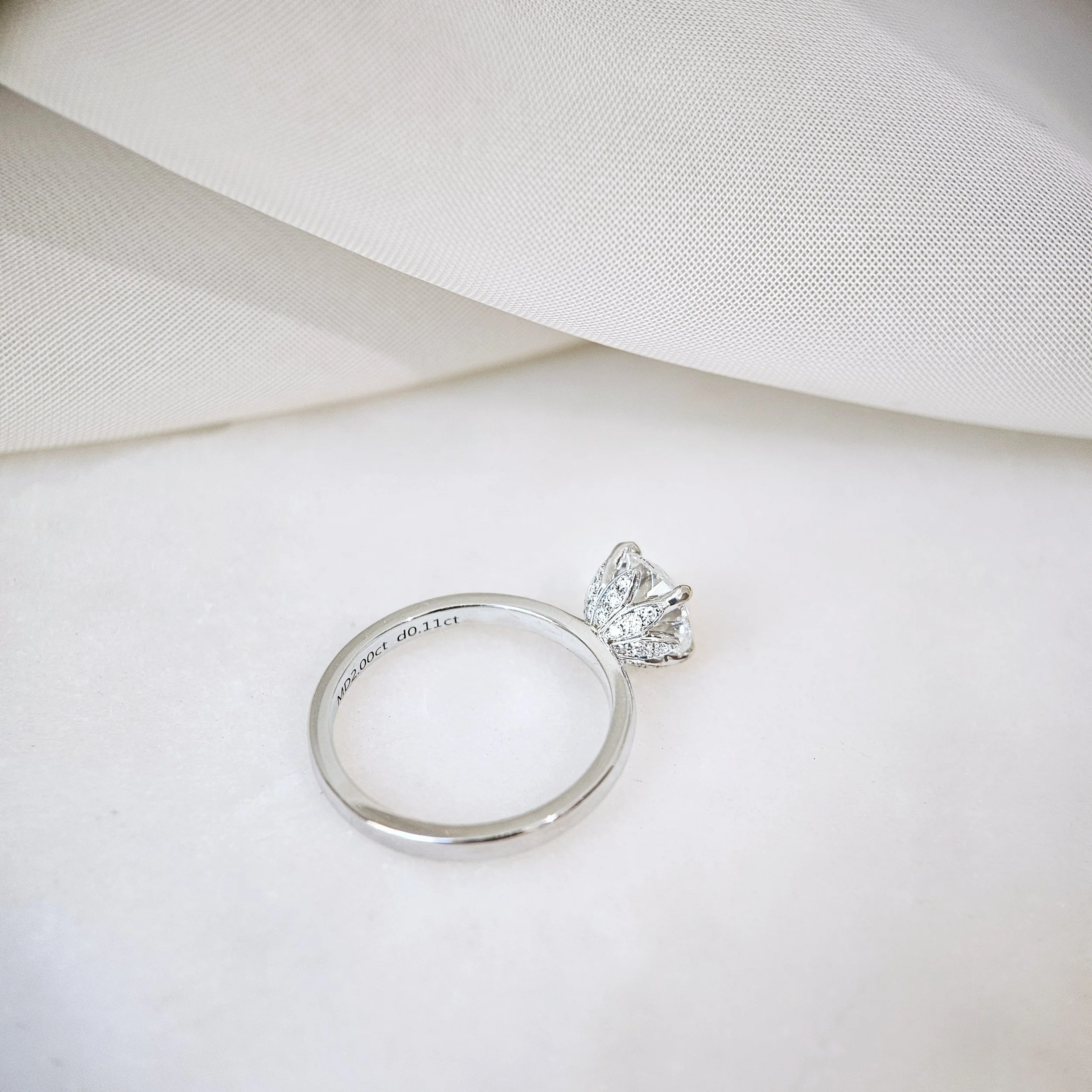 IGI775631866-The Lotus Round Diamond Ring-02.jpeg