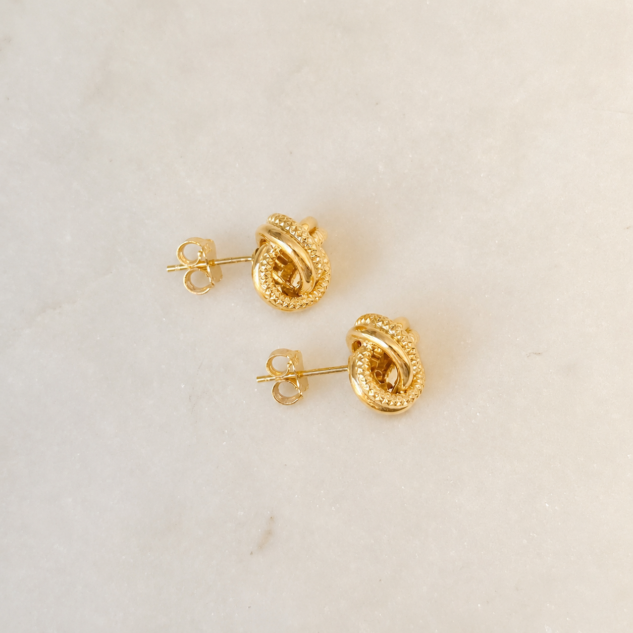 18EKNTI071001*12-TWISTED-KNOT-STUD-EARRINGS-04.png