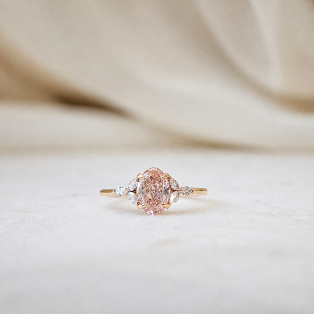 The Shirley Ring featuring a 1.36ct fancy vivid pink oval lab-grown diamond with six marquise accent diamonds in 18K rose gold by Lovélle Jewellery