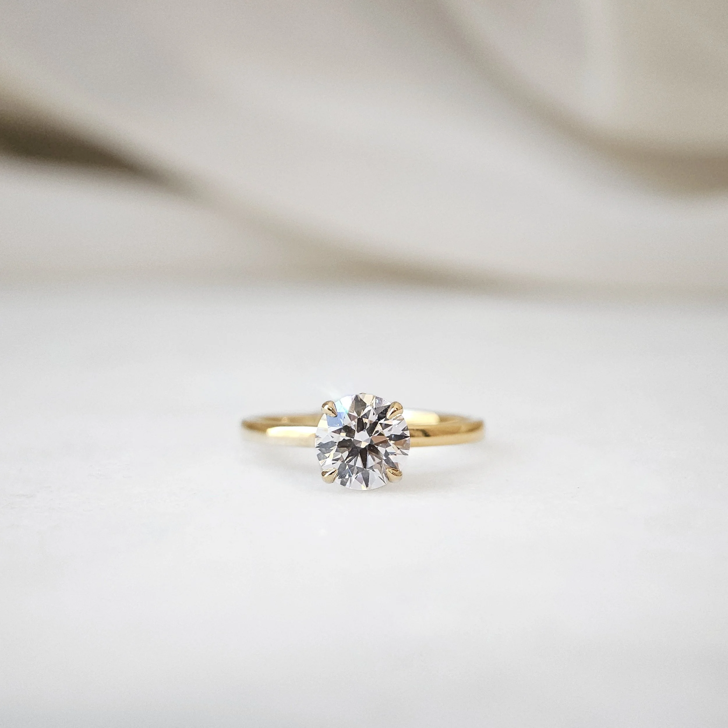 IGI775631866-The Lotus Round Diamond Ring-09.jpeg
