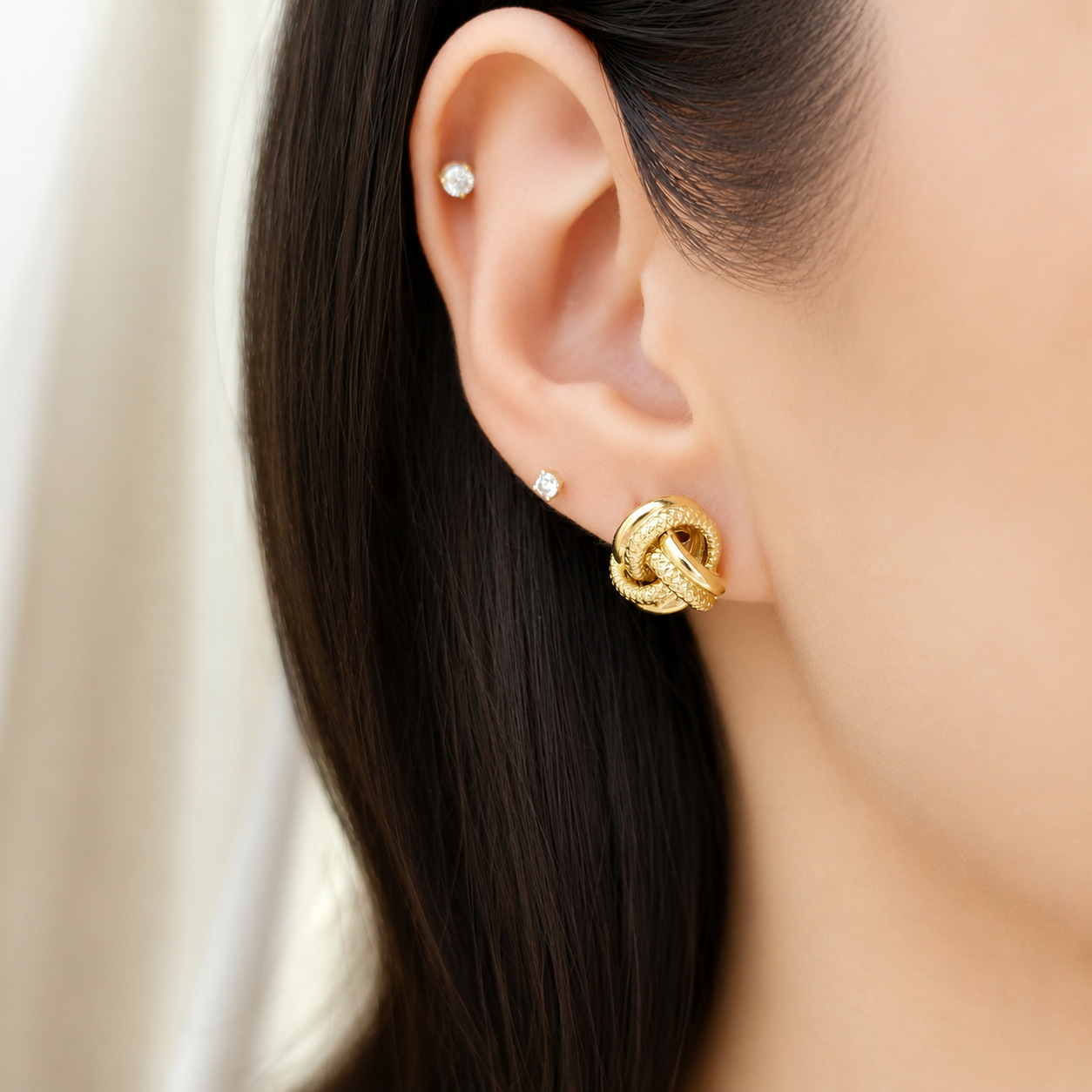 18EKNTI071001*12-TWISTED-KNOT-STUD-EARRINGS-02.png